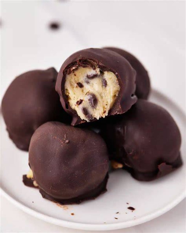 Chocolate cookie dough ball topped with chocolate chips. 