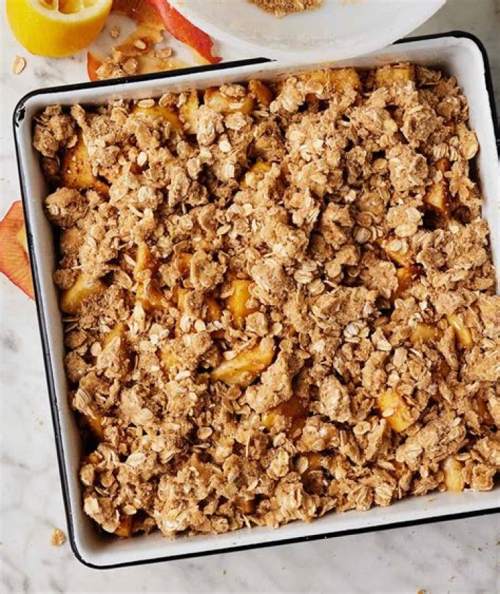 Fruit crisp in a clear pie plate.