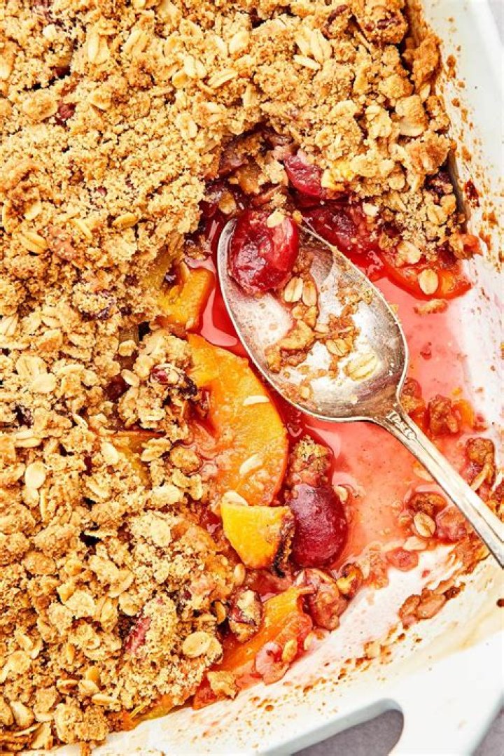 Fruit crisp in a glass pie plate.